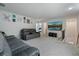 Spacious bonus room with comfortable seating, large-screen television, and neutral decor perfect for entertainment at 5915 Pinnacle View Rd, Cumming, GA 30040