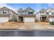 Charming two-story home features a brick facade, attached two-car garage, and well-manicured front lawn at 5915 Pinnacle View Rd, Cumming, GA 30040