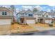 Charming two-story home featuring a brick facade, attached two-car garage, and a well-manicured front yard at 5915 Pinnacle View Rd, Cumming, GA 30040