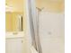 Well-lit bathroom showcases a tub with shower and a sink with modern fixtures at 970 Sidney Marcus Ne Blvd # 1208, Atlanta, GA 30324