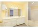 Bright bathroom with a tub-shower combo and long vanity with storage at 970 Sidney Marcus Ne Blvd # 1208, Atlanta, GA 30324