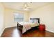 Comfortable bedroom with ceiling fan, wooden floors and natural light from a window at 970 Sidney Marcus Ne Blvd # 1208, Atlanta, GA 30324