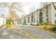 Exterior view of Lenox Villas with well-maintained landscaping and ample parking for residents and guests at 970 Sidney Marcus Ne Blvd # 1208, Atlanta, GA 30324