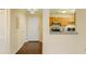 Hallway and a view of the kitchen, featuring wood floors and light walls, connecting living spaces at 970 Sidney Marcus Ne Blvd # 1208, Atlanta, GA 30324