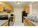 Well-lit kitchen with stainless steel appliances, granite countertops, and ample cabinet space for storage at 970 Sidney Marcus Ne Blvd # 1208, Atlanta, GA 30324