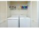 Convenient laundry closet with modern washer and dryer units and storage shelf at 970 Sidney Marcus Ne Blvd # 1208, Atlanta, GA 30324