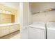 Bright laundry room with washer, dryer, and convenient access to the bathroom at 970 Sidney Marcus Ne Blvd # 1208, Atlanta, GA 30324