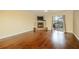 Bright living room with hardwood floors, cozy fireplace, and access to a private outdoor patio area at 970 Sidney Marcus Ne Blvd # 1208, Atlanta, GA 30324