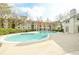 Community pool with clear blue water, surrounded by trees and apartments at 970 Sidney Marcus Ne Blvd # 1208, Atlanta, GA 30324