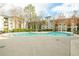 Relaxing community pool surrounded by lush landscaping and multi-story residential buildings at 970 Sidney Marcus Ne Blvd # 1208, Atlanta, GA 30324