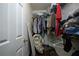 Image of a cluttered walk-in closet with clothes on racks and the floor at 970 Sidney Marcus Ne Blvd # 1208, Atlanta, GA 30324