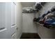 Image of an empty walk-in closet with clothes racks and hardwood flooring at 970 Sidney Marcus Ne Blvd # 1208, Atlanta, GA 30324