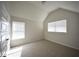 Light-filled bedroom with vaulted ceiling and neutral carpet offers a comfortable retreat at 2551 Bear Mountain St, Lithonia, GA 30058