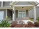 Inviting front porch with brick accents and classic columns, enhancing curb appeal at 2551 Bear Mountain St, Lithonia, GA 30058