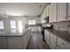 Beautiful kitchen features granite countertops, an island, and a gas stove cooktop at 2551 Bear Mountain St, Lithonia, GA 30058