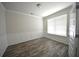 Comfortable home office featuring hardwood floors, white trim, and a large window at 2551 Bear Mountain St, Lithonia, GA 30058