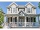 Charming two-story home featuring a welcoming front porch and craftsman-style details, and professional landscaping at 3268 Cates Ne Ave, Brookhaven, GA 30319