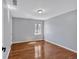 Cozy bedroom with hardwood floors, a large window and a neutral color palette at 3699 Fowler Rdg, Douglasville, GA 30135