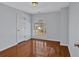 Bedroom featuring hardwood floors, a large window, and neutral paint tones for a calm, relaxing space at 3699 Fowler Rdg, Douglasville, GA 30135