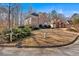 Well-manicured front lawn with an attractive mailbox post leading to a two-story brick home at 3699 Fowler Rdg, Douglasville, GA 30135