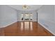 Large living room with hardwood floors, bay window, and views to the fireplace at 3699 Fowler Rdg, Douglasville, GA 30135