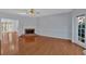 Sun-filled living room boasts hardwood floors, fireplace, and access to other rooms at 3699 Fowler Rdg, Douglasville, GA 30135