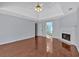 A light-filled main bedroom features hardwood floors, a fireplace, and an ensuite bathroom at 3699 Fowler Rdg, Douglasville, GA 30135