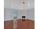 Open main bedroom featuring hardwood floors, a fireplace, and doorway to the bath at 3699 Fowler Rdg, Douglasville, GA 30135