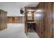 The basement features wood-look wall paneling, carpet, a drop ceiling, and a small sink at 50 Stonington Pl, Marietta, GA 30068