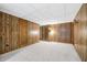 The basement features wood-look wall paneling and carpet at 50 Stonington Pl, Marietta, GA 30068