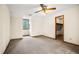 This bedroom features light-colored walls and carpet, trim, and a window at 50 Stonington Pl, Marietta, GA 30068