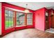 Bright dining room with wood floors, a bay window, and vibrant red walls at 50 Stonington Pl, Marietta, GA 30068