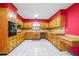 Traditional kitchen with tile floors, wooden cabinets, and ample counter space at 50 Stonington Pl, Marietta, GA 30068