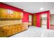 Functional kitchen layout with tile floors, wooden cabinets, and desk space at 50 Stonington Pl, Marietta, GA 30068