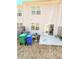 Backyard view featuring a concrete patio, AC unit, and garbage cans on a townhouse at 6408 Kennonbriar Ct, Lithonia, GA 30058