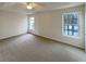 Bright and airy bedroom with neutral walls, carpet, and natural light at 890 Abbotts Mill Ct # 75, Duluth, GA 30097