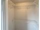 This walk-in closet features white walls and wire shelving for easy storage and organization at 890 Abbotts Mill Ct # 75, Duluth, GA 30097