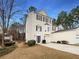 Beautiful beige two-story home with an attached garage and manicured landscaping at 890 Abbotts Mill Ct # 75, Duluth, GA 30097