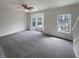 Spacious living room featuring a bay window and neutral carpet at 890 Abbotts Mill Ct # 75, Duluth, GA 30097