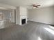 The living room features a fireplace and is adjacent to dining area at 890 Abbotts Mill Ct # 75, Duluth, GA 30097