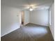 A large living room with lots of light and neutral colored carpet at 890 Abbotts Mill Ct # 75, Duluth, GA 30097