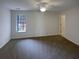 A large main bedroom with lots of light and neutral colored carpet at 890 Abbotts Mill Ct # 75, Duluth, GA 30097