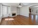 Spacious living room with hardwood floors, a fireplace, and built-in shelving at 10067 Freeman Ct, Jonesboro, GA 30236