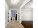 The bright hallway with tile flooring flows into rooms with gleaming hardwood at 1525 Thornwood Dr, Jonesboro, GA 30236