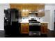 Kitchen featuring stainless steel appliances and wood cabinets at 1525 Thornwood Dr, Jonesboro, GA 30236