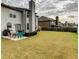 Spacious backyard with a patio and well-maintained lawn, perfect for outdoor activities and relaxation at 3419 In Bloom Way, Auburn, GA 30011