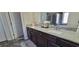 Bathroom vanity with granite counters and dual sinks, offering style and convenience for a modern lifestyle at 3419 In Bloom Way, Auburn, GA 30011