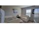 Inviting bedroom with daybeds, cheerful floral patterns, and a window bringing in natural light at 3419 In Bloom Way, Auburn, GA 30011