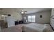 Spacious primary bedroom with a seating area and a large window, creating a comfortable retreat at 3419 In Bloom Way, Auburn, GA 30011