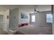 This large bonus room features carpet and natural light from the window, great for entertaining or relaxing at 3419 In Bloom Way, Auburn, GA 30011
